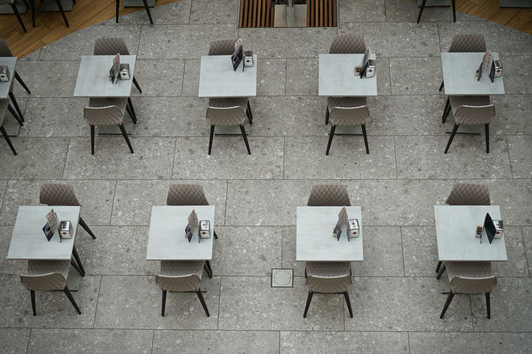 High angle view of chairs and tables in building