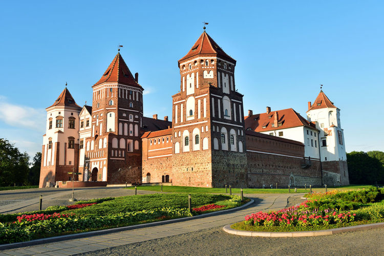 View of buildings against clear blue sky