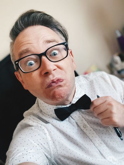 Portrait of nerdy man with eyeglasses and bowtie
