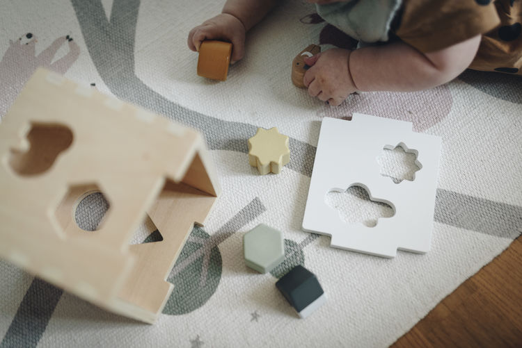 Baby playing with wooden blocks