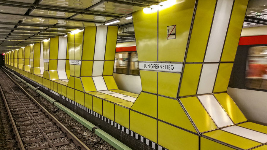 Speeding blurred train at underground railway station