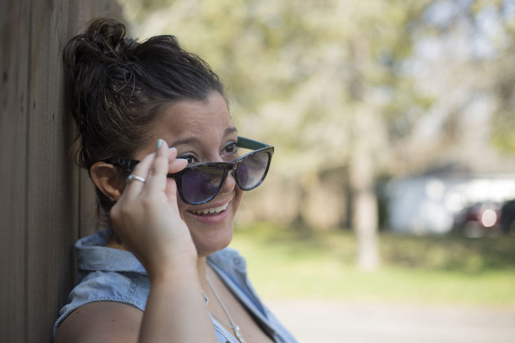 Close-up of young woman in sunglasses