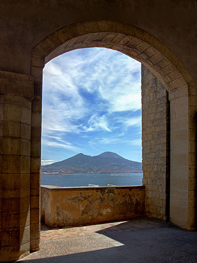 Scenic view of sea against sky seen through archway