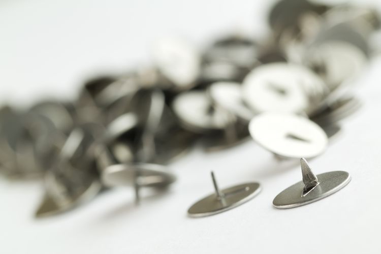 Close-up of screws on white background