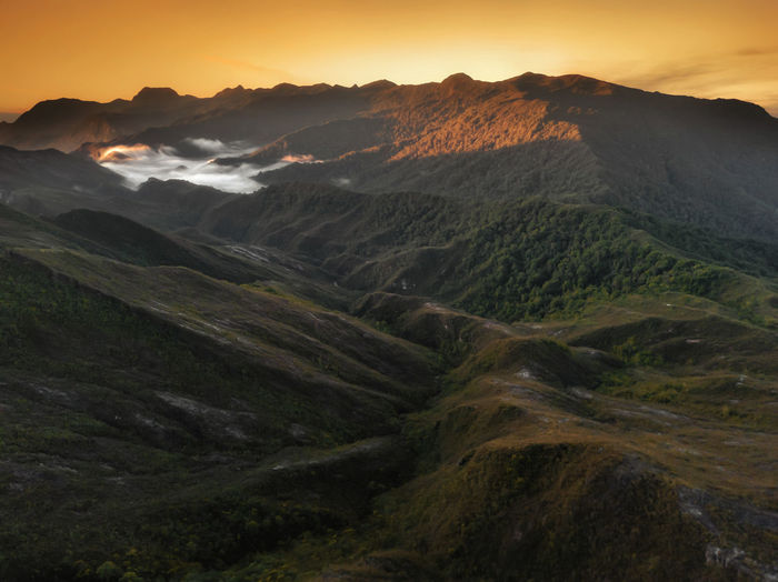 Scenic view of landscape against sky during sunset