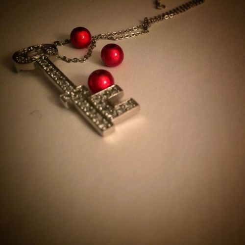 Close-up of red object over white background