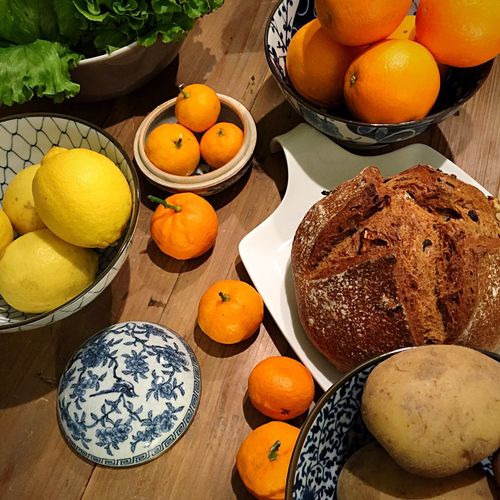 High angle view of bread with fruits on table