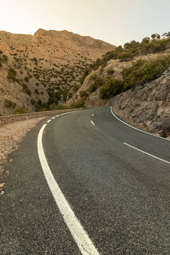 Beautiful asphalt road between mountains in mallorca, spain