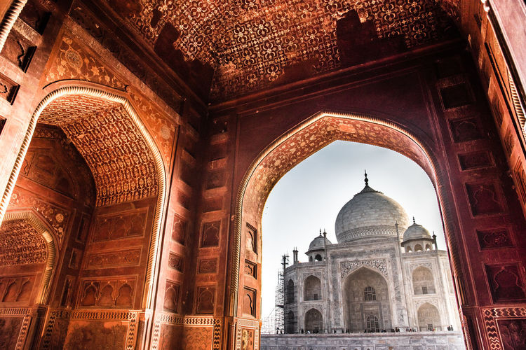 Low angle view of historical building taj mahal through arch