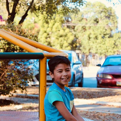 Portrait of smiling boy in playground