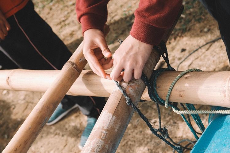 High angle view of people making barrel raft