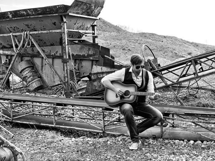 Portrait of men sitting on land, guitar, men with guitar, 