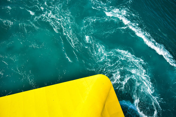 High angle view of yellow boat in sea