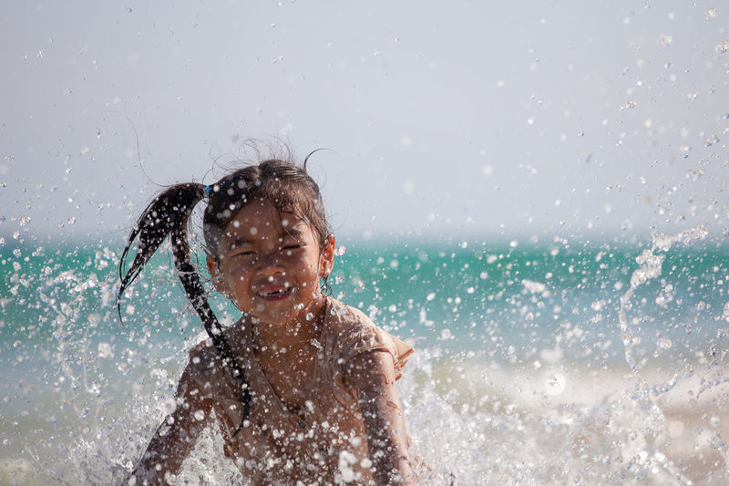 Girl playing in sea