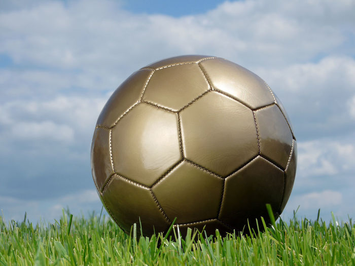 Close-up of soccer ball on field