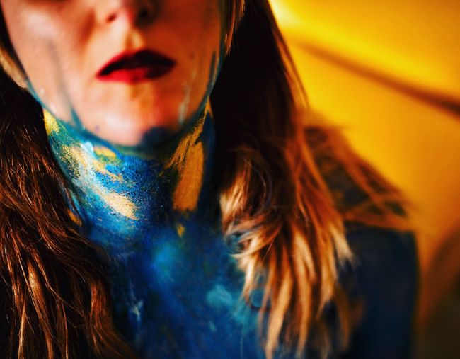 Close-up midsection of young woman with powder paint