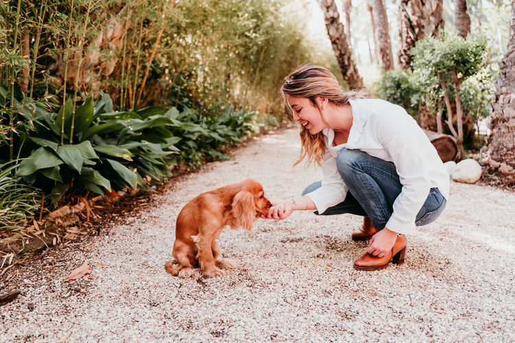 Young woman with dog at home