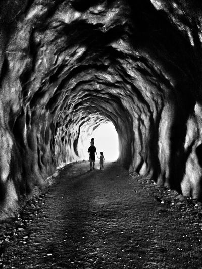 Father and his children in tunnel