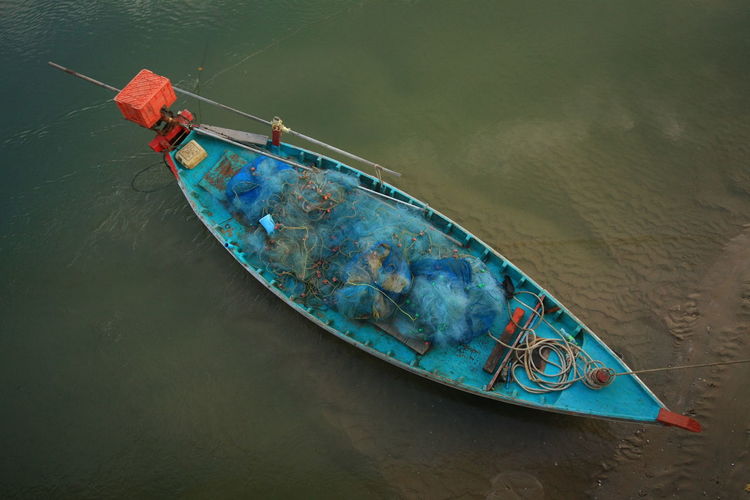 High angle view of boat moored on river