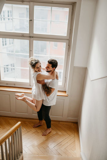 Couple standing at home