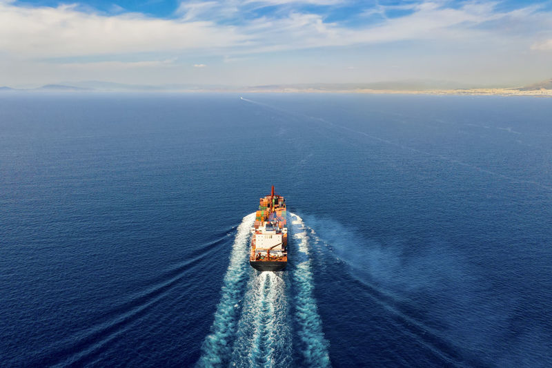 High angle view of boat in sea against sky