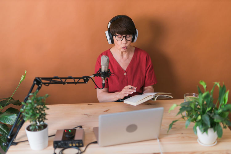 Senior woman narrates book during podcast
