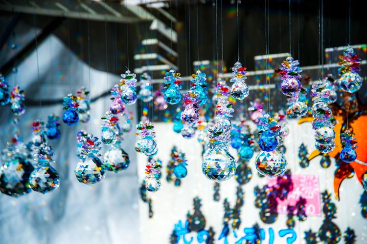 Close-up of crystal balls hanging in store