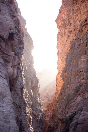 Sun streams through a richly-colored canyon