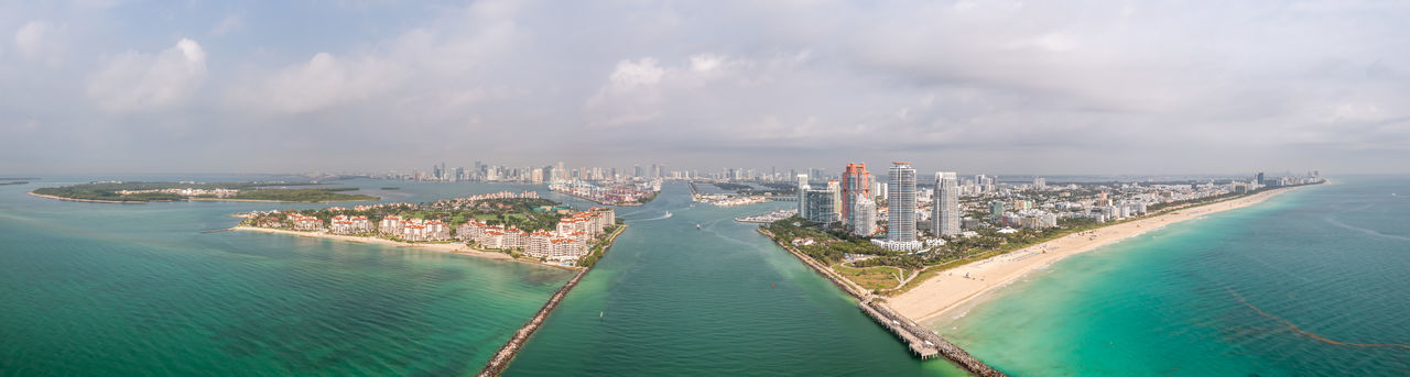 Panorama aerial of miami beach and fishers island looking towards miami over the shipping canal.
