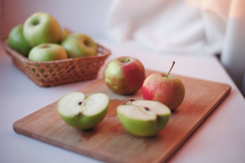 Close-up of apples on cutting board