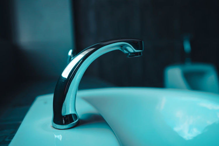 Close-up of blue faucet