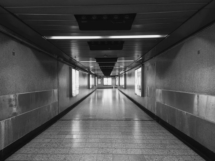 Black and white interior of subway in hong kong mass transit railway station
