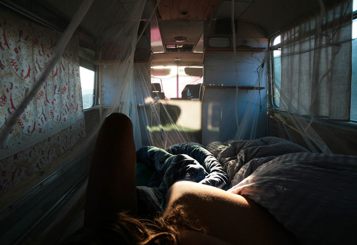 Young woman lying in motor home