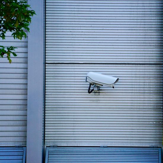 Security camera on the wall of the building