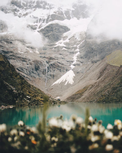 Scenic view of lake and snowcapped mountains