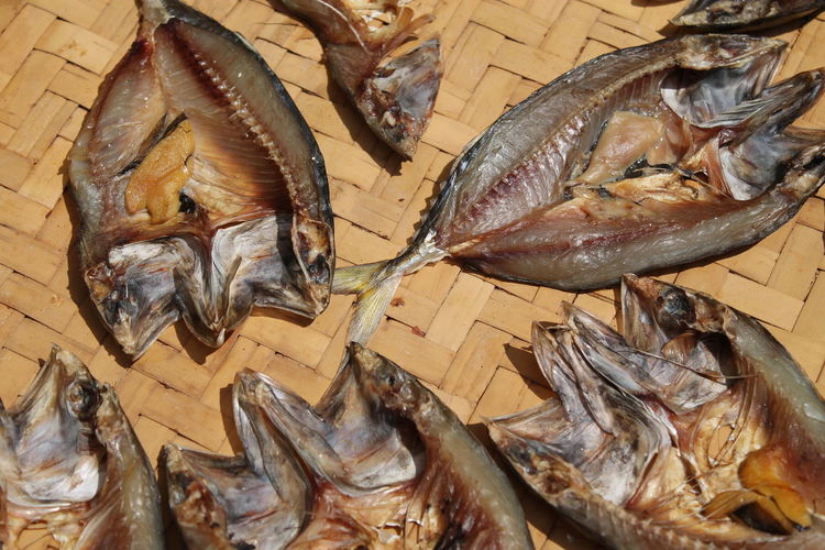 High angle view of dried fish on wicker plate