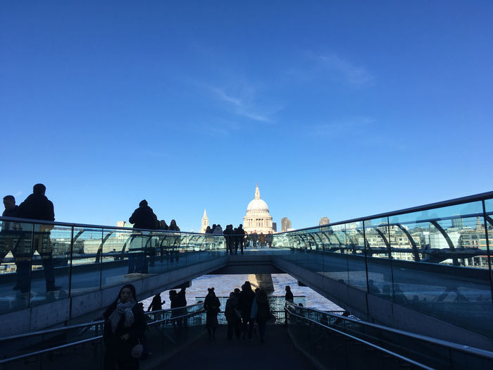 People on millennium footbridge in city