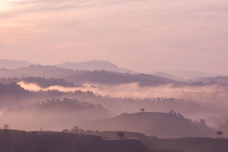 Scenic view of mountains against sky during sunset