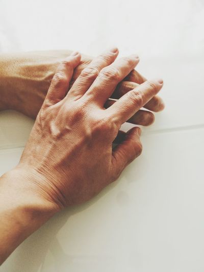 Cropped image of hands on table