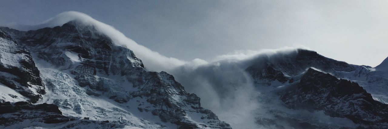 Panoramic view of eiger against sky during foggy weather