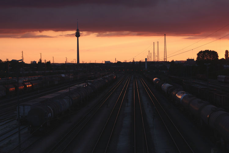 High angle view of railroad tracks against sky during sunset