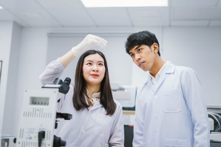 Scientist examining test tube in laboratory