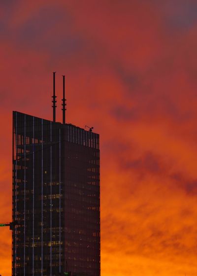 Modern building against orange sky