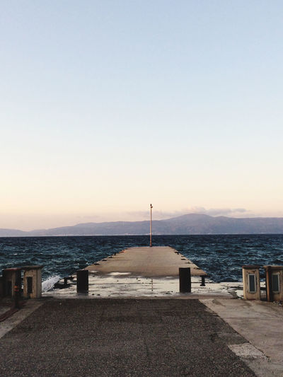 Scenic view of sea against clear sky during sunset