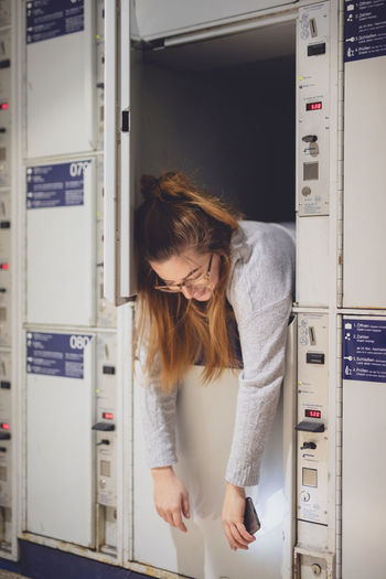 Young woman relaxing in locker
