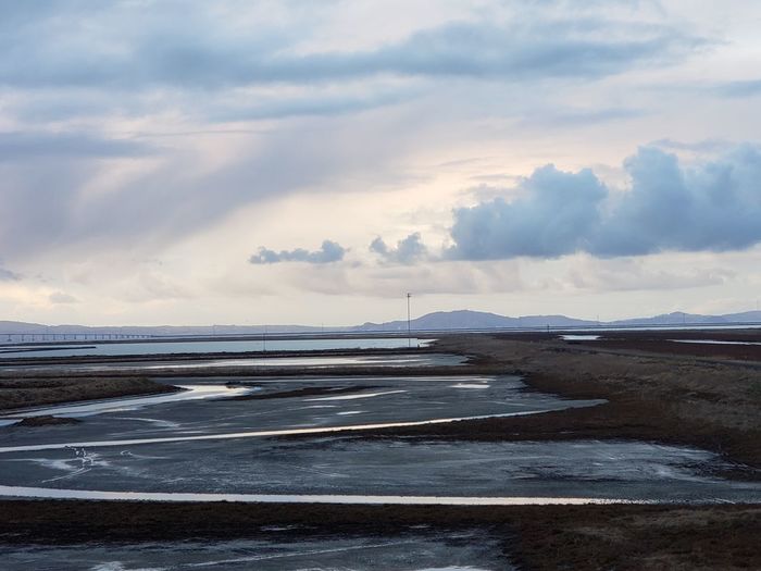 Scenic view of sea against sky during winter