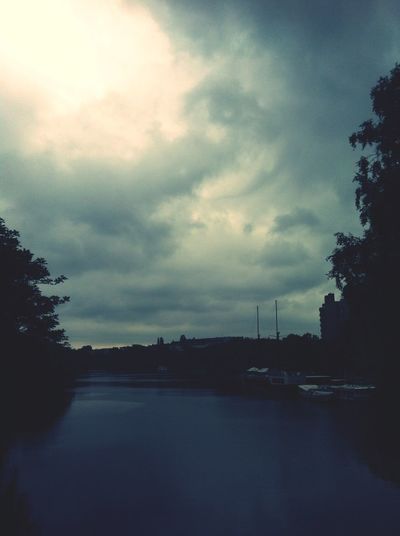 View of river against cloudy sky