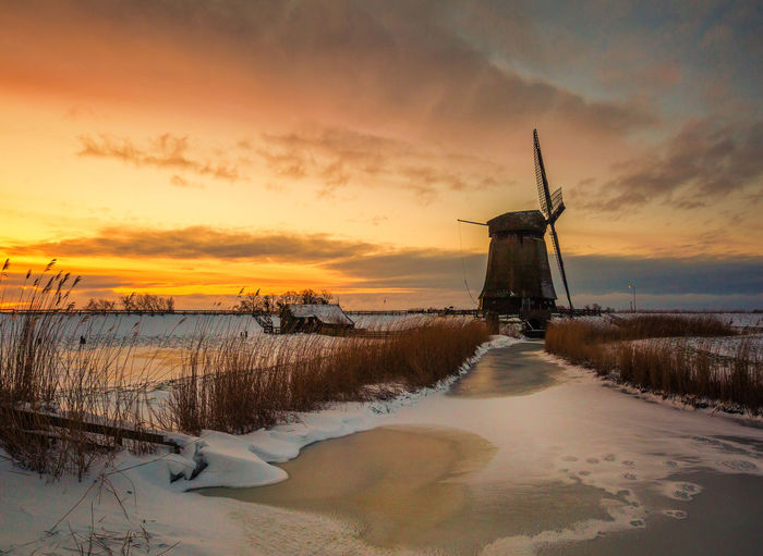 View of windmill during sunset