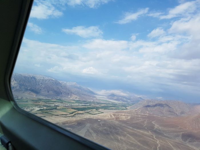 Aerial view of landscape seen from airplane window