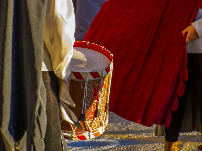 Midsection of people in traditional clothing